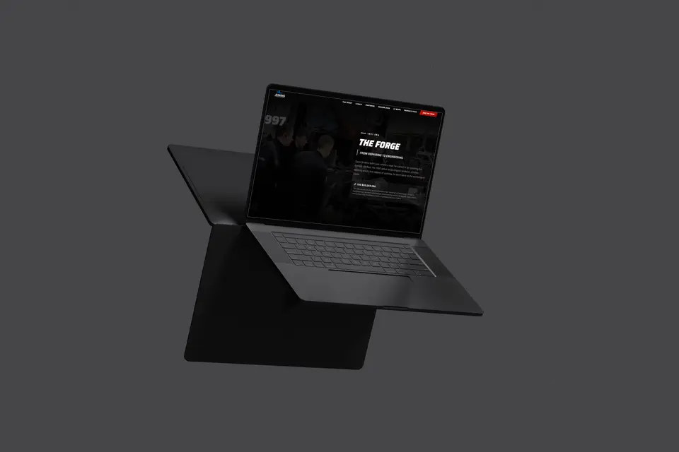 Laptop showing The Forge page on the Jenkins Motorsports site.